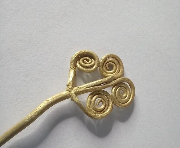 a gold ring-brooch